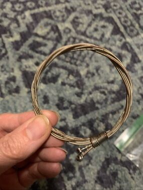 Vintage guitar string bracelet in used condition